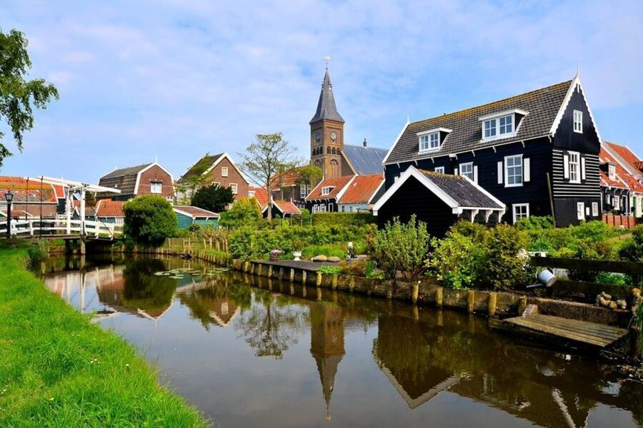 Amsterdam: Windmills, Edam, Volendam and Marken Private Tour - Marken and the winding road: calm village charm that feels different from Volendam