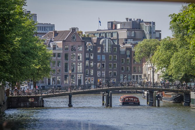 Anne Frank Private Bike Tour in Amsterdam - Stop 1: The Amstel and the memorial context you actually need