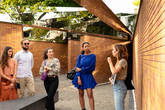 Anne Frank's Story - Guided Walking Tour through Amsterdam - Dam Square and the Anne Frank statue, connecting the story to public Amsterdam