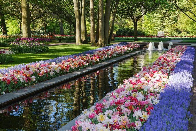 Day Trip to Keukenhof Gardens from Amsterdam with Tour Guide - Inside Keukenhof: Oranje Nassau, Carolus Clusius, and Your Free-Walk Time