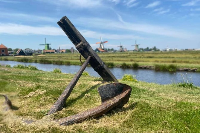 Escape Amsterdam: E-Bike to Zaanse Schans Windmills & Zaandam - From a live windmill to farm fields and cows at Landsmeer