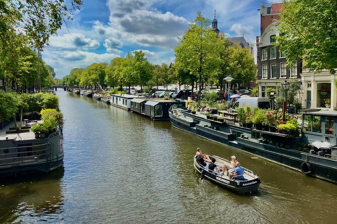 Exclusive Cheese Walk & Dutch Wine Discovery - Passing the Anne Frank House, then moving into the Jordaan flow