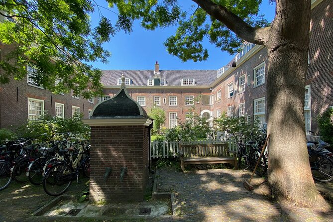Explore hidden streets with friends - Dam Square and the town hall building you keep seeing in photos