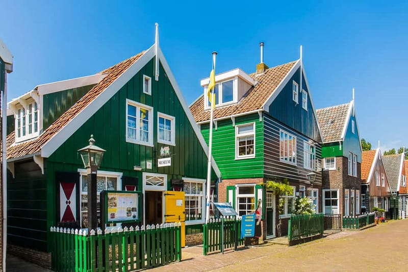 From Amsterdam: Zaanse Schans, Volendam, and Marken Day Trip - Wooden shoe factory: how clogs went from work gear to souvenir