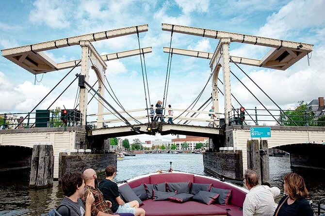 Guided Amsterdam Canal Cruise – Snacks & Drinks on board(1 Hour) - From the ship-shaped waterfront building to Jewish heritage sites