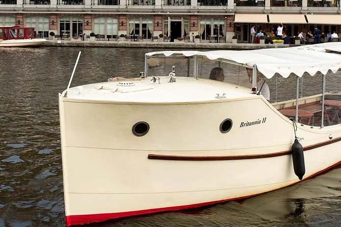 Guided Amsterdam Canal Cruise – Snacks & Drinks on board(1 Hour) - Seven aligned arch bridges, plus the kiss-legend drawbridge