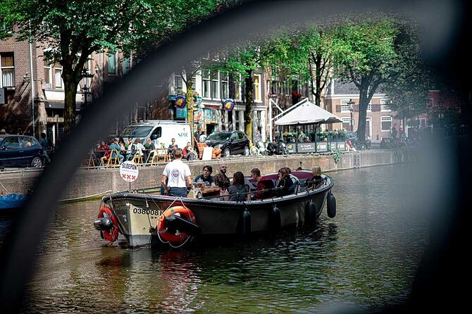 Guided Amsterdam Canal Cruise – Snacks & Drinks on board(1 Hour) - Crooked canal houses and old city wall remnants