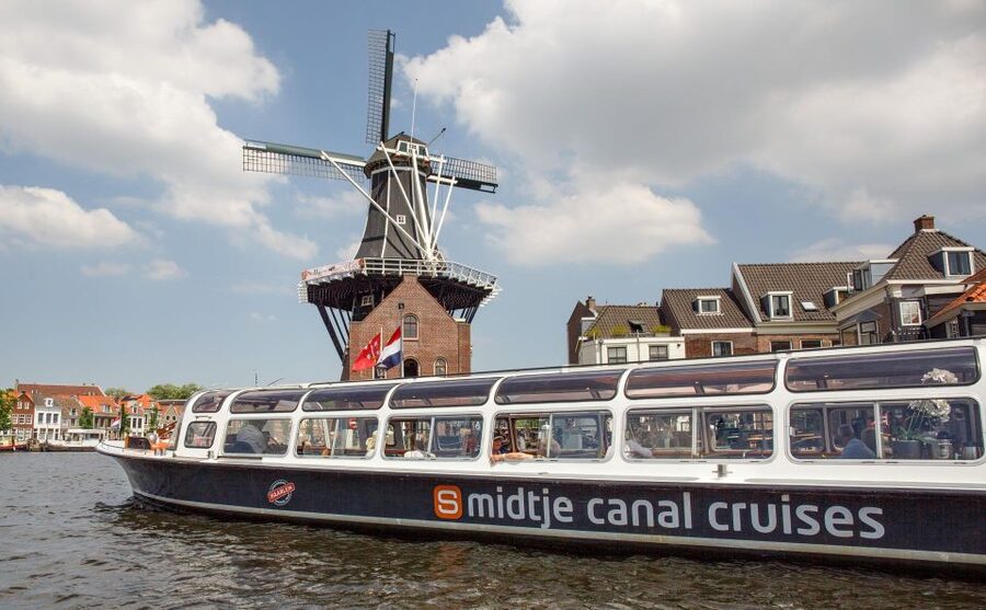 Haarlem: Sightseeing Canal Cruise through the City Center - Heaters, audio guides, and the sound of a boat motor
