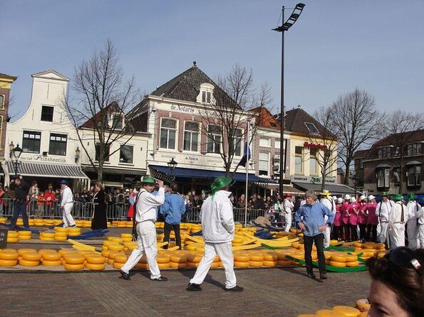 Half-Day Edam and Volendam Private Walking Tour from Amsterdam - Volendam City Center: Promenade Views, Herring, Cheese, and Legends
