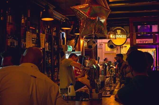 New Year's Eve Pub Crawl With Optional Club Entrance - Midnight in Amsterdam: Dam Square, the bubbly bottle, and the countdown feel