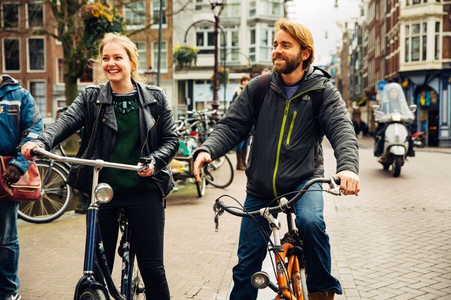 Private Amsterdam Bike Tour with a Local - Museumplein, a Skinny Bridge Crossing, and the Blood Graffiti House Story