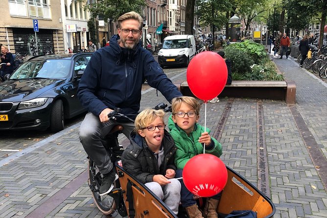 Private Amsterdam Bike Tour with a local guide (also for families) - Getting into the city center via the old station hub