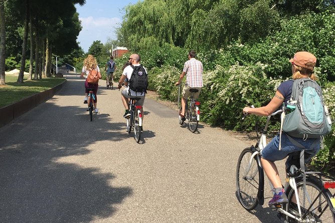 Private Amsterdam Bike Tour with a local guide (also for families) - Anne Frank House exterior views and Dam Square, the story starts fast