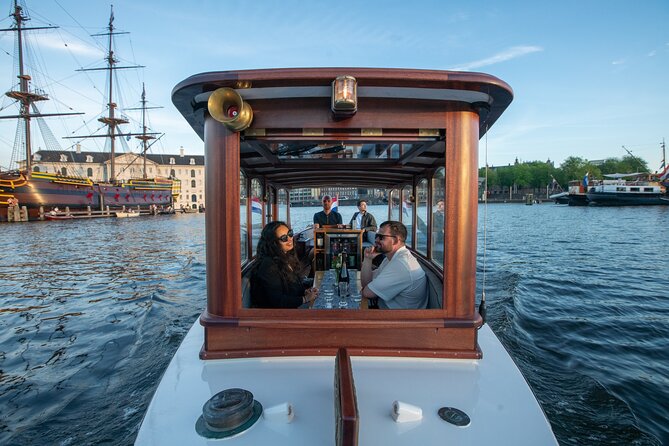 Private Boat Tour Amsterdam - 90 Min incl. welcome drink on historic saloon boat - What you do on a 90-minute canal ride, and why “passing by” still matters