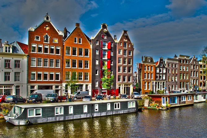 Private departure transfer from Amsterdam to Schiphol Airport (AMS) - Inside the Vehicle: Air Conditioning, Mobile WiFi, and Soft Refreshments