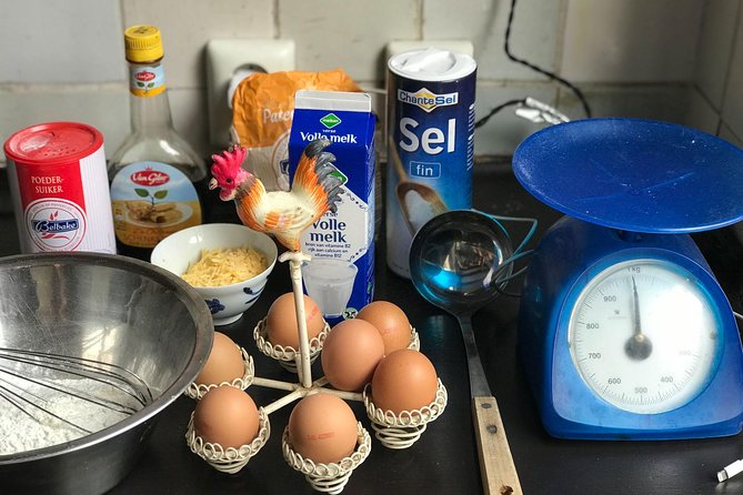 Private Dutch Pancake Cooking Class in an Amsterdam Canal Home - Eating at the kitchen table with wine, cheese, and stories