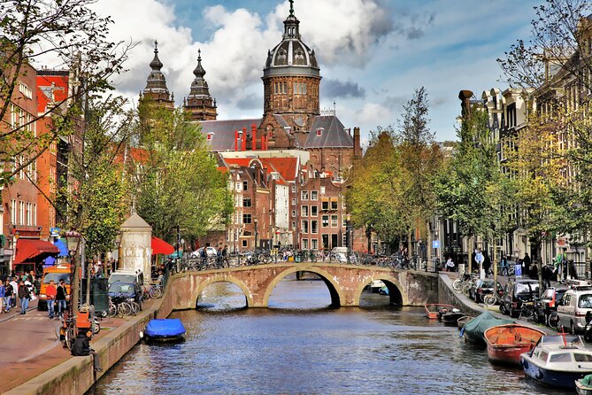 Private walking tour Amsterdam. English or Spanish. - Waterlooplein, the Tower of the Coin, and Why Streets Feel Specific