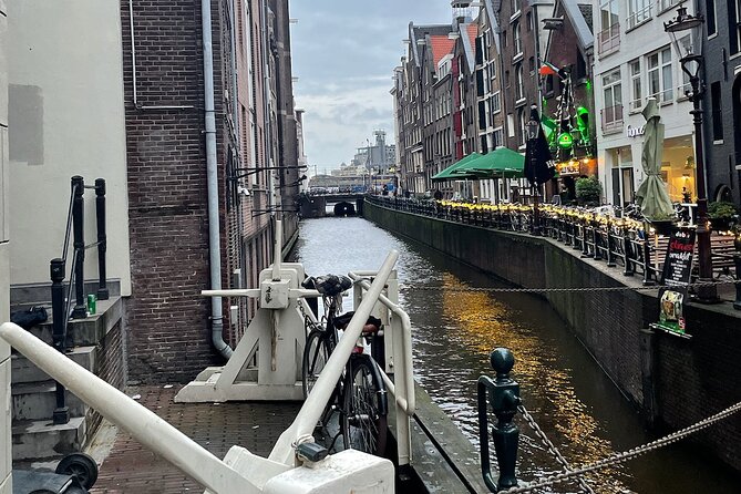 Private Walking Tour of Amsterdam - Stop 4: the first pretty train station idea, and how far it reaches