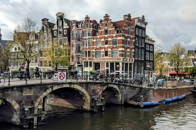 Rembrandt & Van Gogh Amsterdam walking experience - Tivoli Doelen Amsterdam Hotel and Blauwbrug: Hals, a rare painting story, and a strong ending view