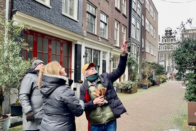 Small Group Walking Tour in Amsterdam with Friendly and Fun Guide - Canal Views and the 17th-Century Shockwave