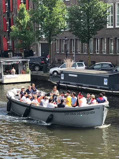 Visit Amsterdam by Boat with a French Guide (french) - Small Electric Boat, Small Group, Real Canal Access
