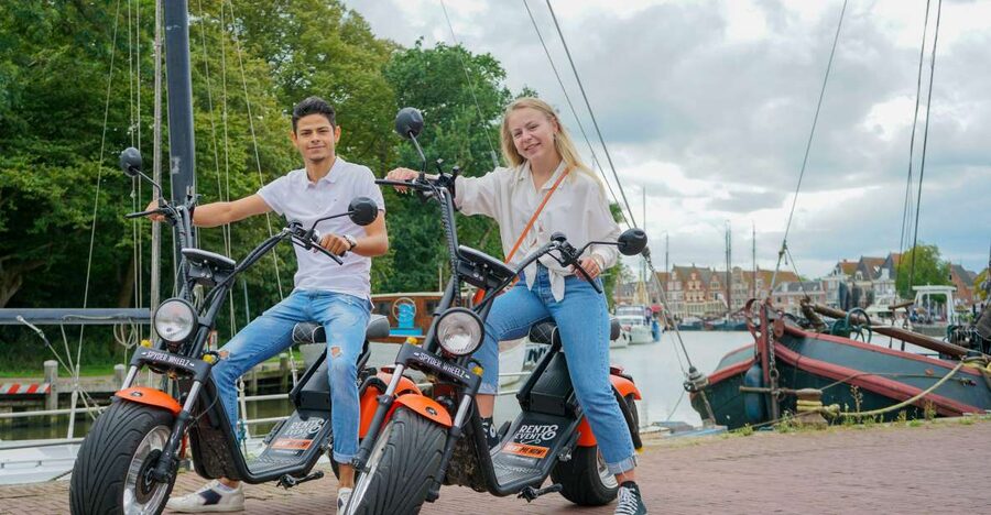 Volendam: E-Scooter Rental - The dikes, meadows, cows, and working windmills you actually get to see