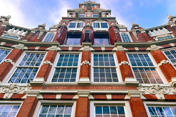 Walking Tour about Golden Age Architecture, private local guide - Prinsengracht Warehouses: The Hoisting-Beam Practical Side Of Prestige