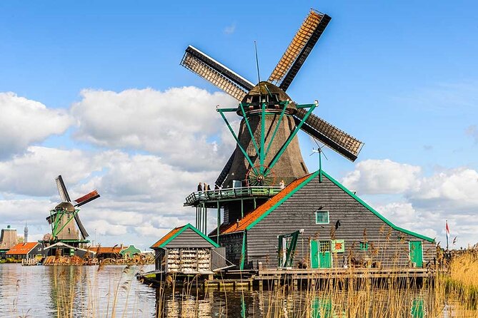 Zaanse Schans Windmills E Bike Day Trip from Amsterdam - Zaandam chocolate, Inntel Hotels color, and ferry time on Hempont