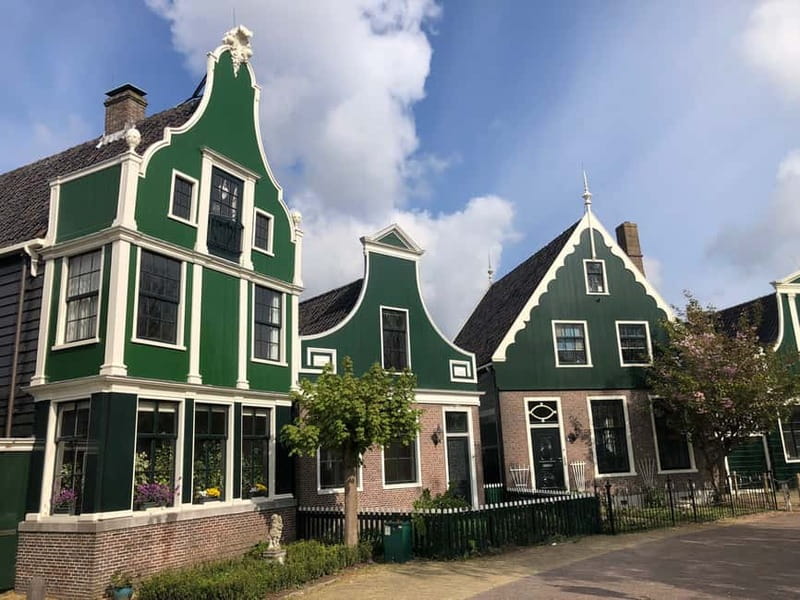 Zaanse Schans Windmills, Fishing Villages & Countryside - Volendam on foot: colorful houses, a cheese stop, and a food-friendly pause
